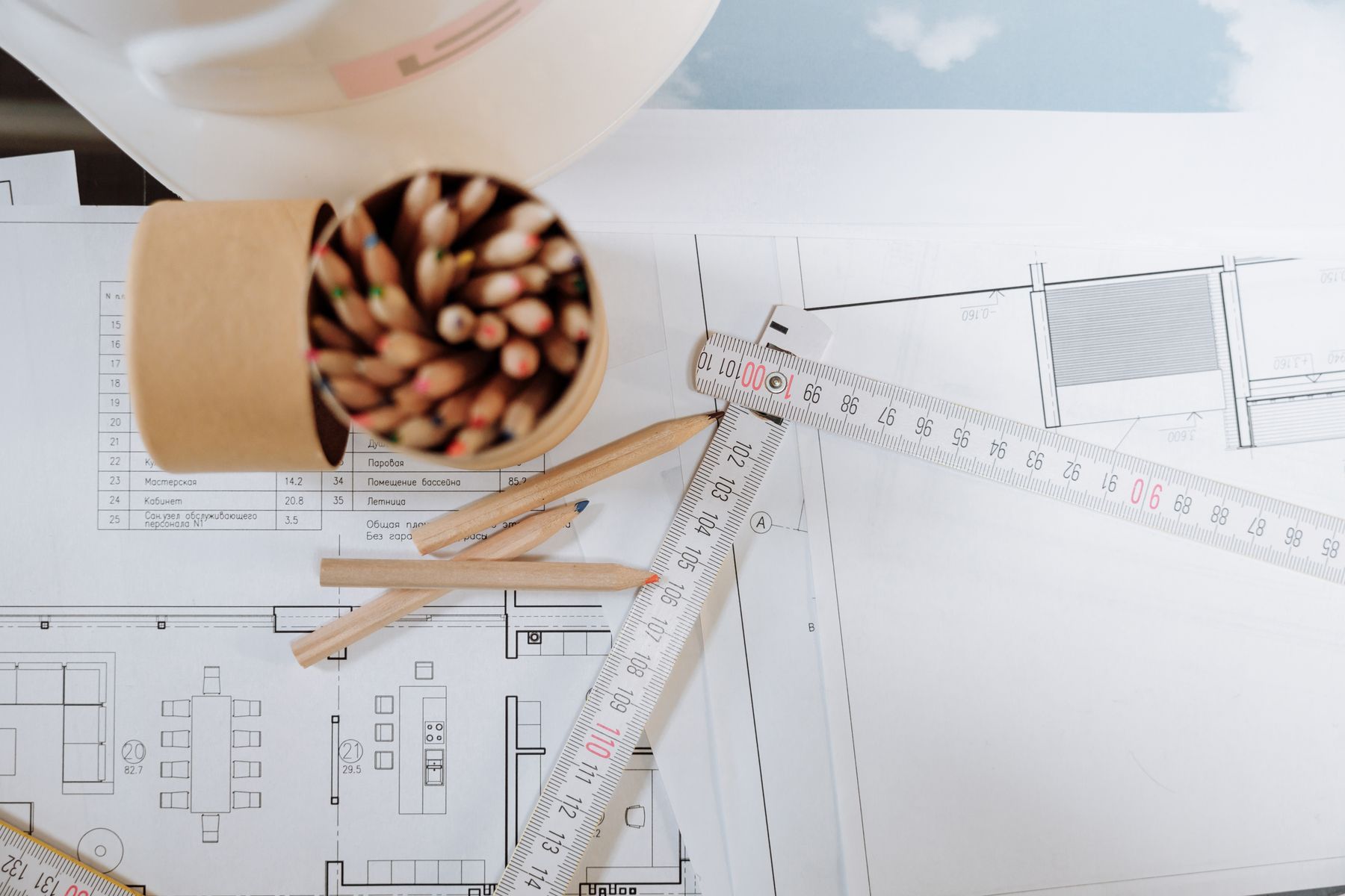 Architectural drawings with pencils and a scale ruler