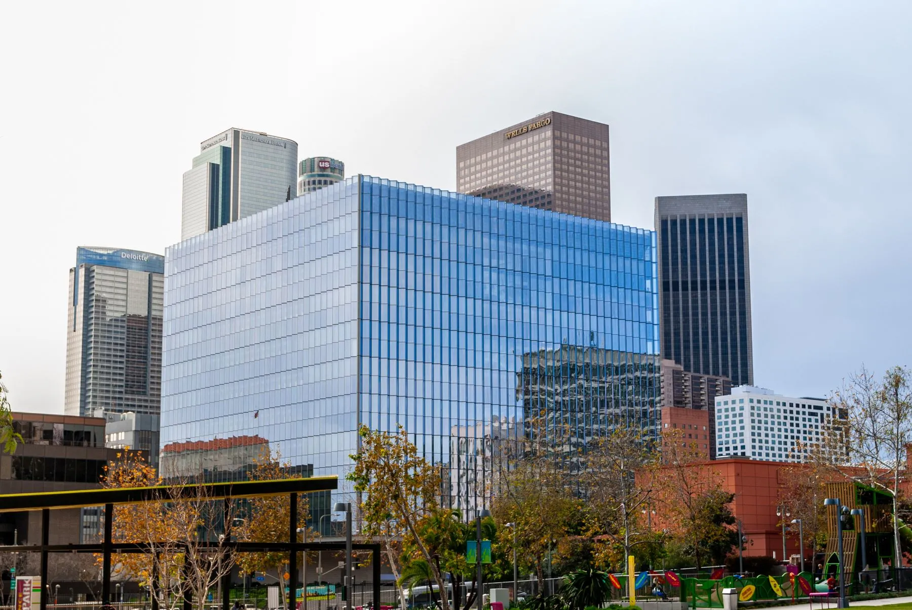 Downtown Los Angeles in daylight, a glass office block in front of the high rise core