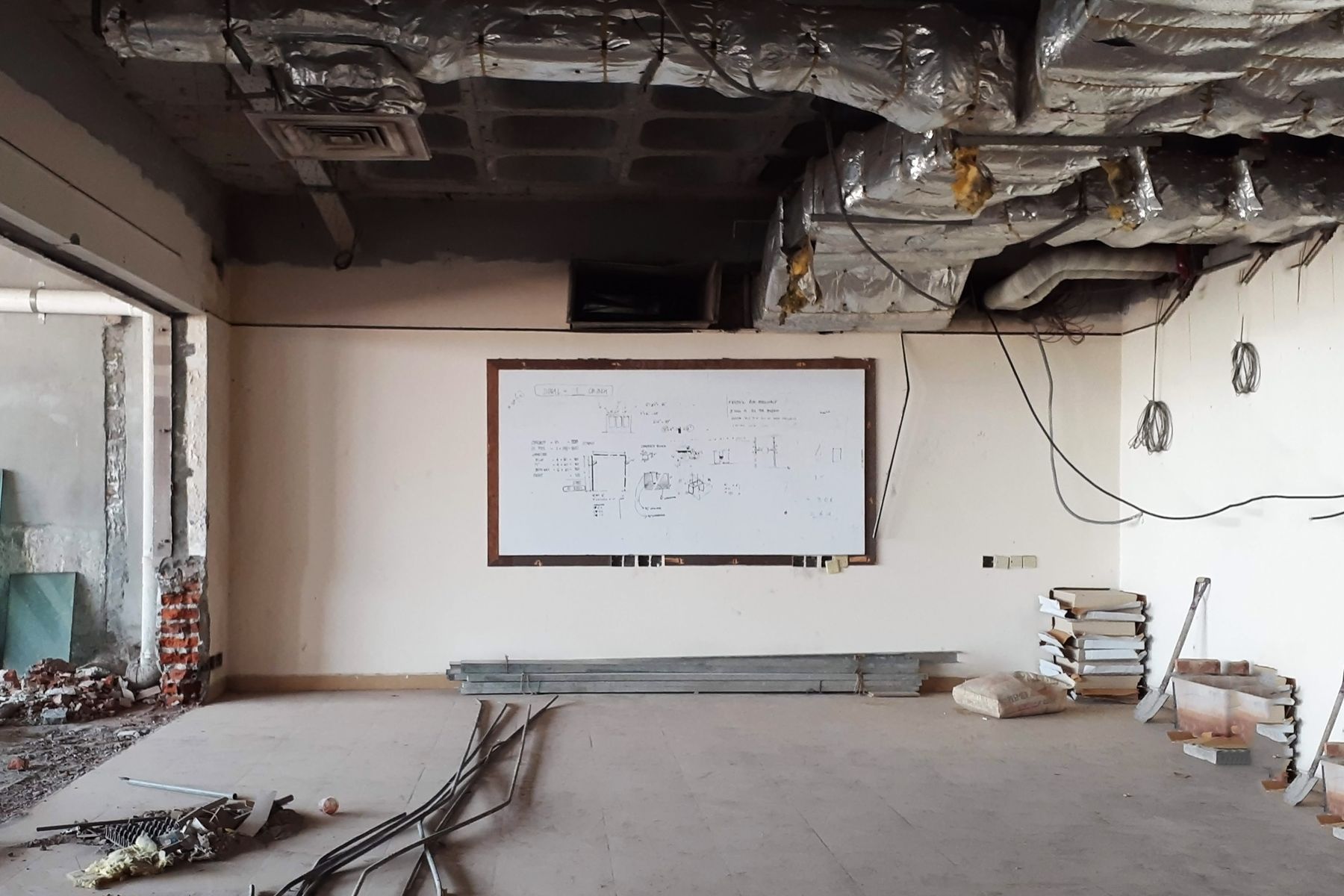Commercial space under renovation with an open ceiling