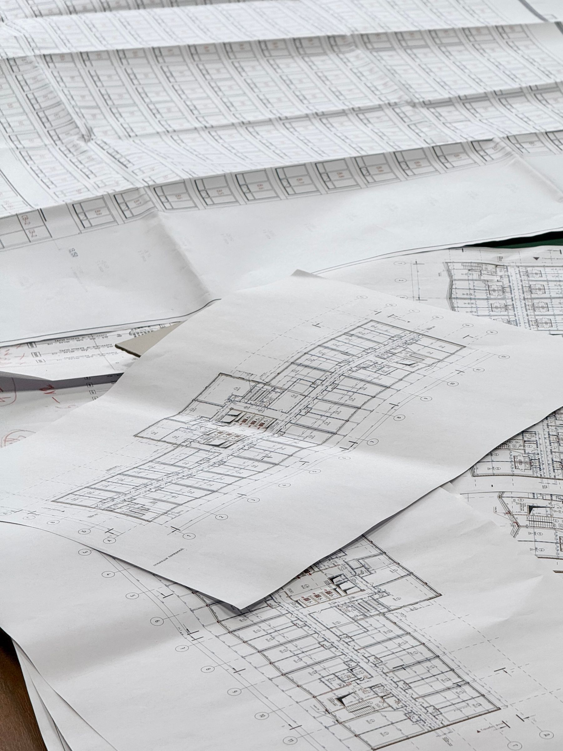 Construction drawings spread across a desk