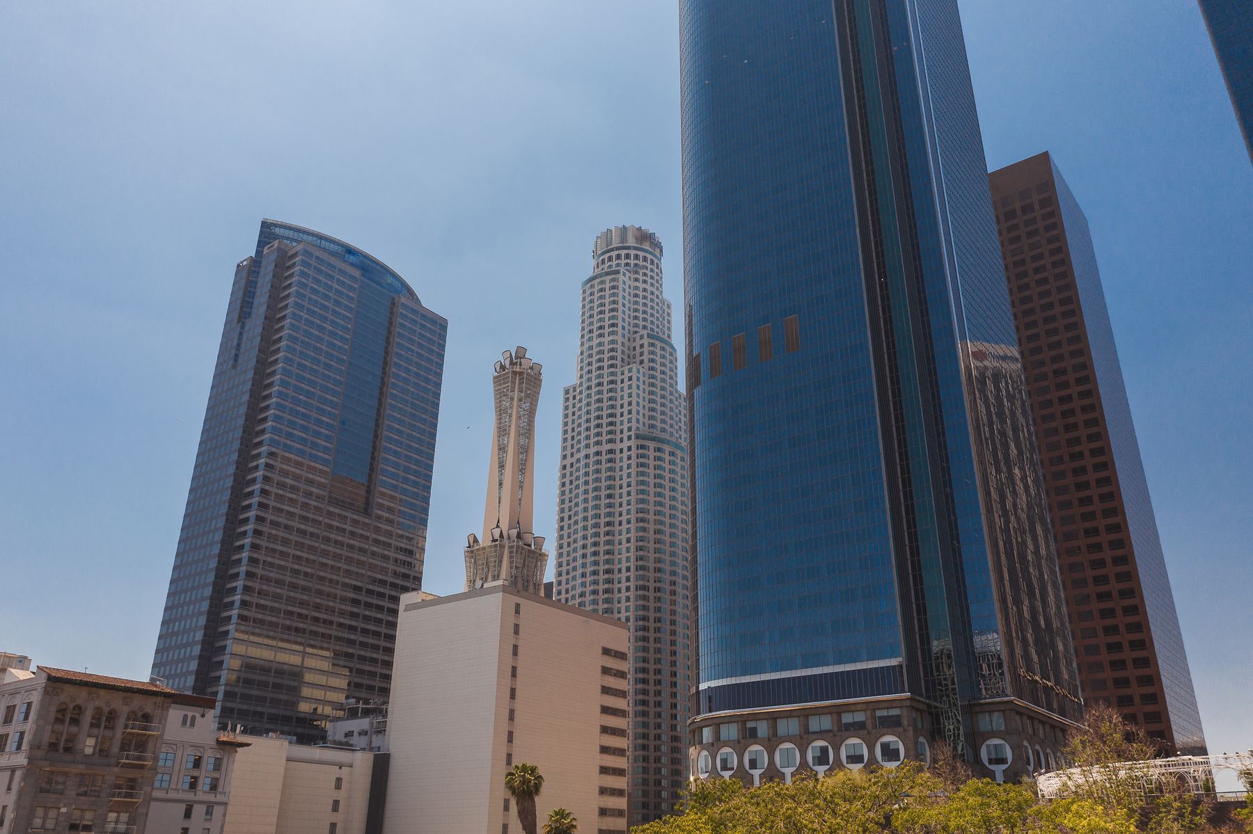 Looking up at the downtown Los Angeles high rise core against a clear sky